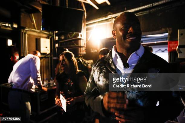 American engineer, former NASA astronaut and former wide receiver for the NFL's Detroit Lions Leland Devon Melvin prepares backstage before the...