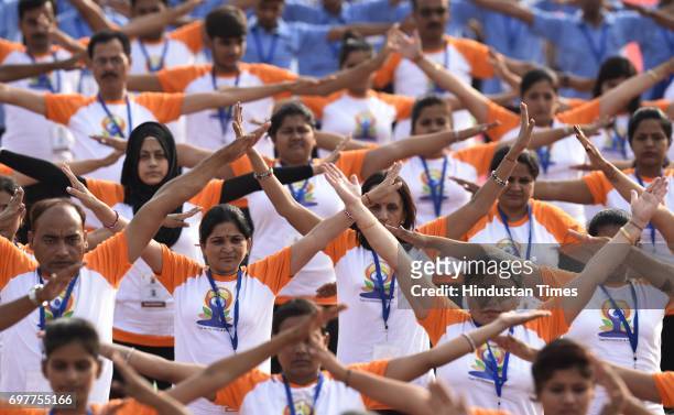 People practice Yoga on final dress rehearsal for coming International Yoga Day in early morning at Ramabai Ambedkar Maidan on June 19, 2017 in...