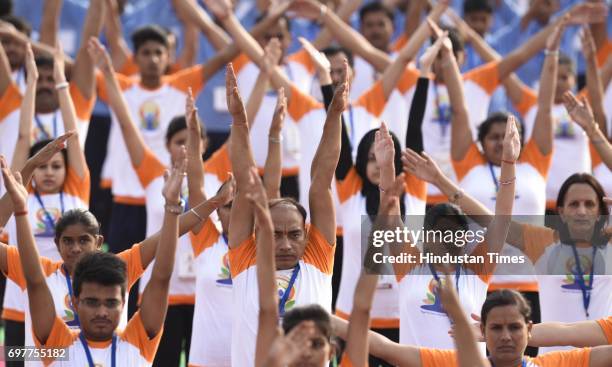 People practice Yoga on final dress rehearsal for coming International Yoga Day in early morning at Ramabai Ambedkar Maidan on June 19, 2017 in...