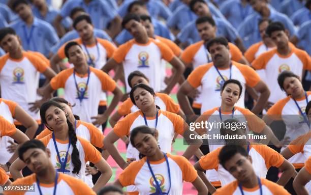 People practice Yoga on final dress rehearsal for coming International Yoga Day in early morning at Ramabai Ambedkar Maidan on June 19, 2017 in...