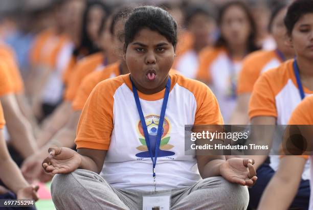 People practice Yoga on final dress rehearsal for coming International Yoga Day in early morning at Ramabai Ambedkar Maidan on June 19, 2017 in...