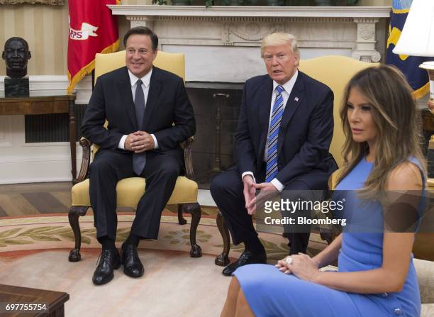 First Lady Melania Trump, from right, U.S. President Donald Trump, and Juan Carlos Varela, Panama's president, sit during a meeting in the Oval...