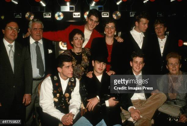 Members of the New Kids On The Block pose for photographs along with their parents at a New Kids On The Block promotional appearance circa 1989 in...