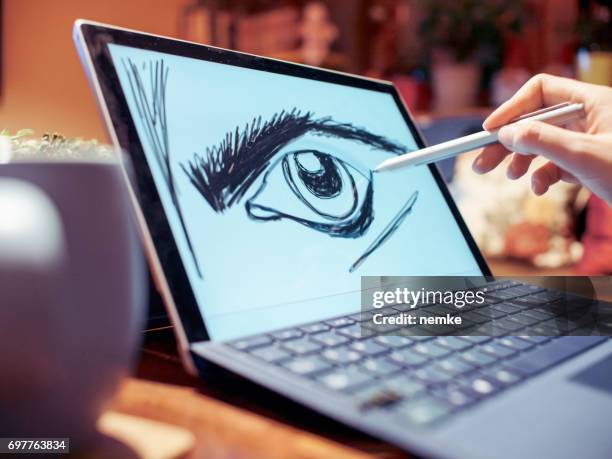 young professional in creative office using graphic tablet - graphic designer sketching stock pictures, royalty-free photos & images