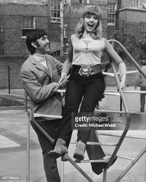 British actors John Alderton and Carol Hawkins as they appear in the British comedy film, 'Please Sir!', directed by Mark Stuart, 5th May 1971. The...