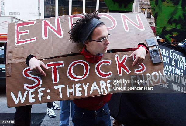 Opponents of the World Economic Forum hold a demonstration against Enron in front of the New York offices of Arthur Andersen February 4, 2002 in New...