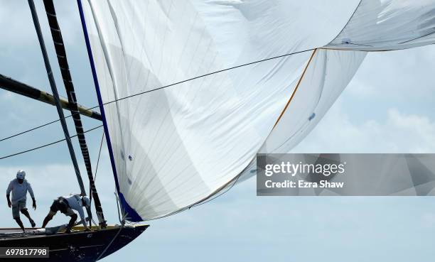 Sailors on Topez fix the sail during the America's Cup J Class Regatta on June 19, 2017 in Hamilton, Bermuda.