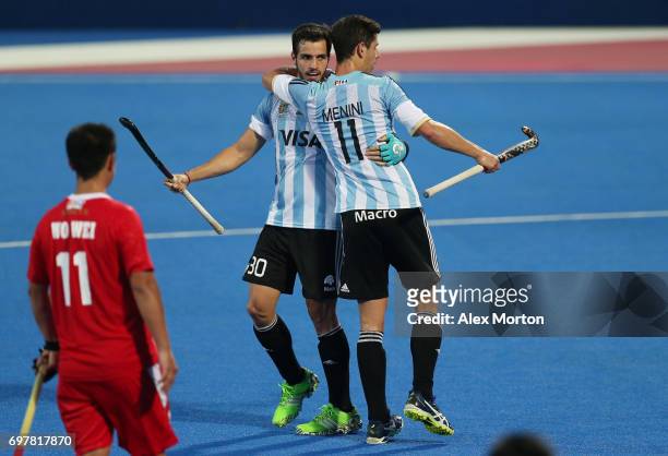 Agustin Bugallo of Argentina is congratulated by Joaquin Menini of Argentina after scoring his team's eighth goal during the Pool A match between...