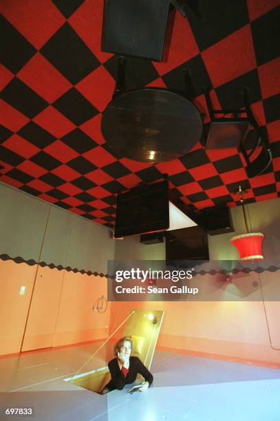 Vanessa Stahnke, girlfriend of hotel owner Lars Stroschen, poses in the Upside Down Room February 16 one of the many creative and even bizarre rooms...