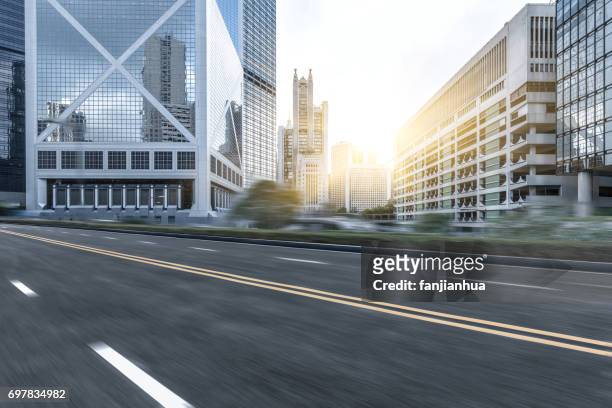 empty downtown street intersection - urban road stock pictures, royalty-free photos & images