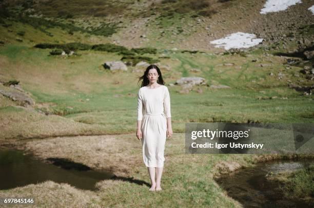 woman near the river in mountains - women white dress stock pictures, royalty-free photos & images