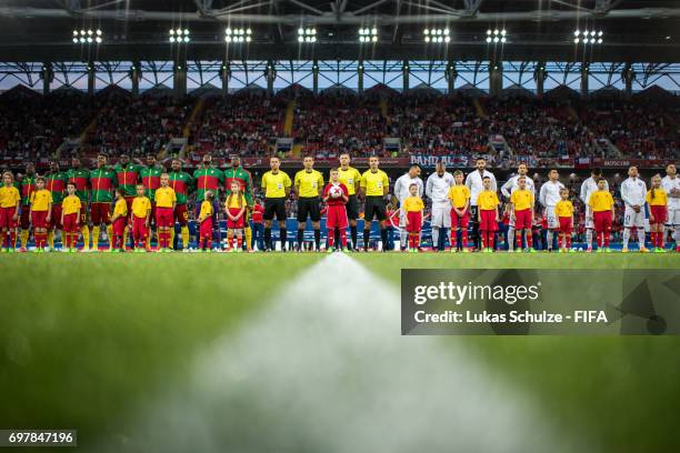 Both teams line up prior to the FIFA Confederations Cup Russia 2017 Group B match between Cameroon and Chile at Spartak Stadium on June 18, 2017 in...