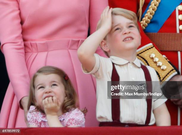 Princess Charlotte of Cambridge and Prince George of Cambridge watch the flypast from the balcony of Buckingham Palace during the annual Trooping the...