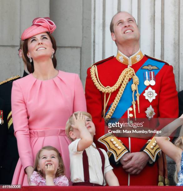 Catherine, Duchess of Cambridge, Princess Charlotte of Cambridge, Prince George of Cambridge and Prince William, Duke of Cambridge watch the flypast...