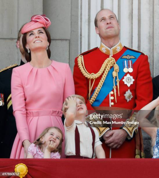 Catherine, Duchess of Cambridge, Princess Charlotte of Cambridge, Prince George of Cambridge and Prince William, Duke of Cambridge watch the flypast...