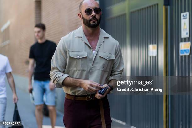 Milan Vukmirovic wearing a khaki button shirt is seen outside Fendi during Milan Men's Fashion Week Spring/Summer 2018 on June 19, 2017 in Milan,...