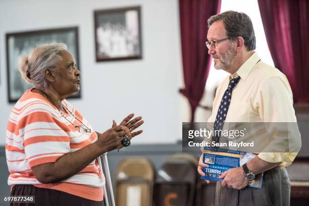 Democratic congressional candidate Archie Parnell talks with Bettie Toney June 19, 2017 in Bishopville, South Carolina. Voters will choose between...
