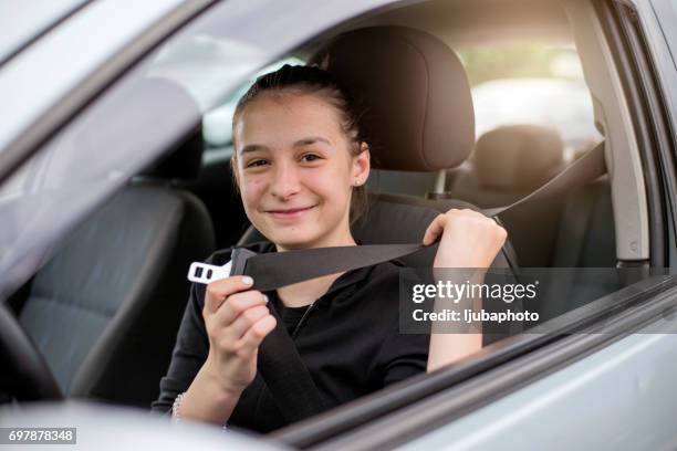 wherever you go, go safely - girl driving imagens e fotografias de stock