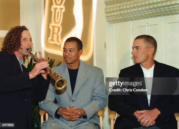 Musician Kenny G opens the annual PGA Tour awards ceremony with the tours 2001 Player of the Year, Tiger Woods , and Rookie of the Year, Charles...