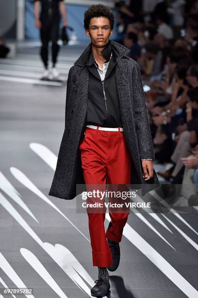 Model walks the runway at the Prada show during Milan Men's Fashion Week Spring/Summer 2018 on June 18, 2017 in Milan, Italy.