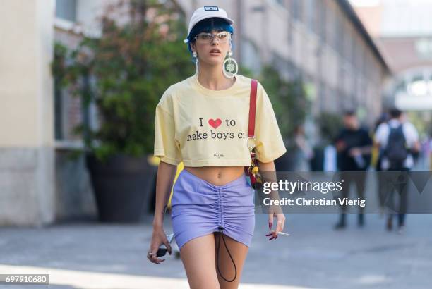 Sita Abellan wearing a cropped tshirt with the print I love make boys cry is seen outside Malibu 1992 during Milan Men's Fashion Week Spring/Summer...