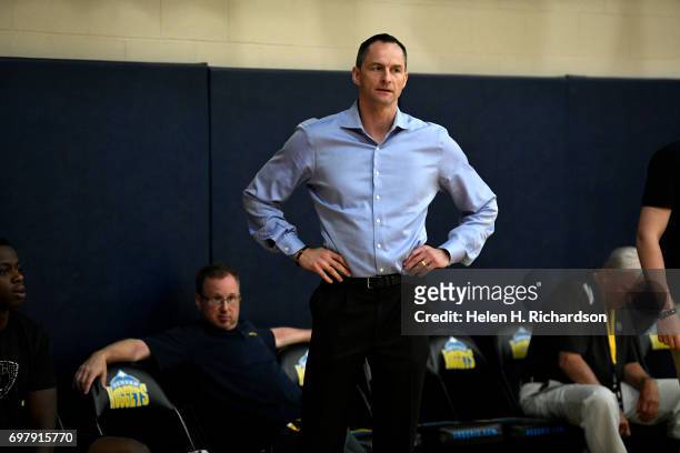 Arturas Karnisovas, General Manager for the Denver Nuggets, watches potential draft picks during a pre-draft workout for NBA hopefuls at the practice...
