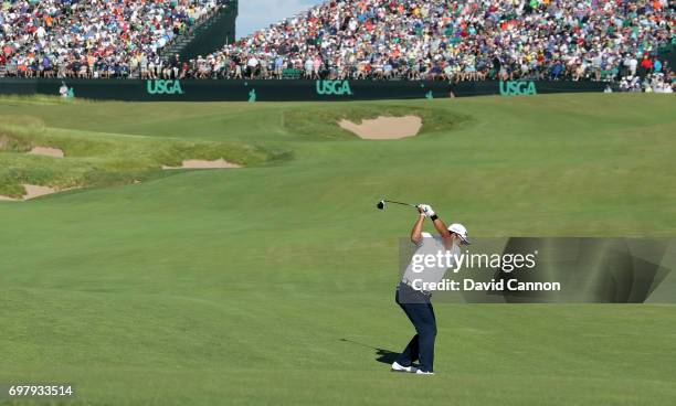 Hideki Matsuyama of Japan plays his second shot at the par 5, 18th hole during the final round of the 117th US Open Championship at Erin Hills on...