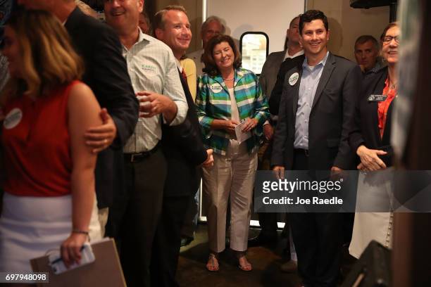 Republican candidate Karen Handel laughs as she waits to be introduced to speak during a campaign stop at Houck's Grille as she runs for Georgia's...