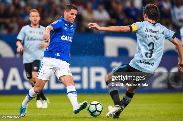 Thiago Neves of Cruzeiro and Pedro Geromel of Gremio battle for the ball during a match between Cruzeiro and Gremio as part of Brasileirao Series A...