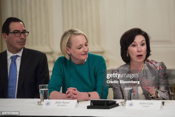 Safra Catz, co-chief executive officer of Oracle Corp., right, speaks as Julie Sweet, chief executive officer of North America at Accenture PLC,...