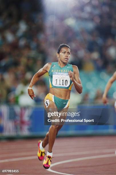 Australian track athlete Cathy Freeman competes in the heats prior to finishing in first place to win the gold medal in the final of the Women's 400...