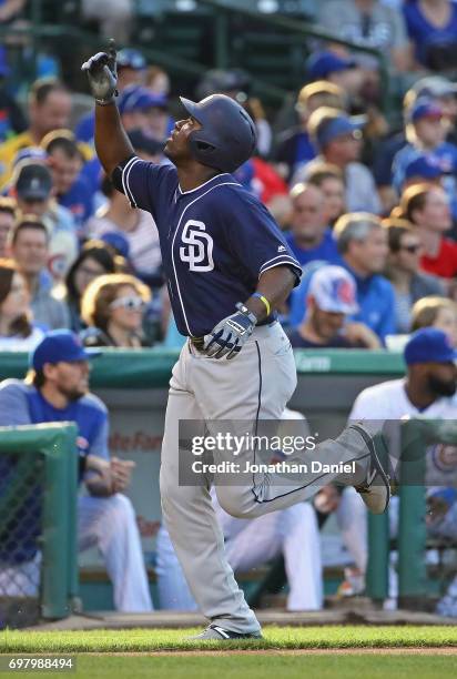 Jose Pirela of the San Diego Padres celebrates as he runs the bases after hitting a lead off home run in the 1st inning against the Chicago Cubs at...