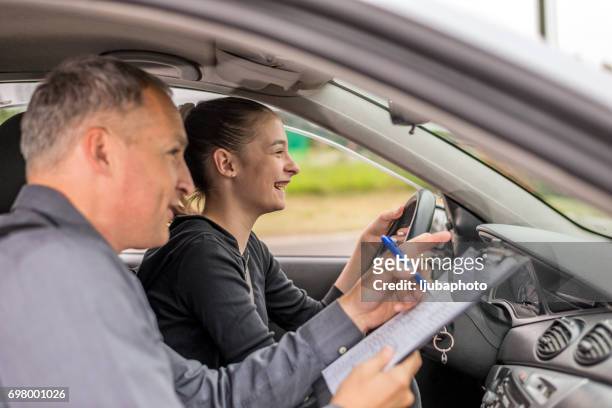 driving test, focused on the road ahead of her - driving instructor stock pictures, royalty-free photos & images
