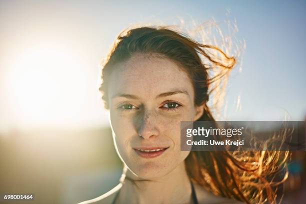 portrait of young woman - portrait sunlight stock pictures, royalty-free photos & images