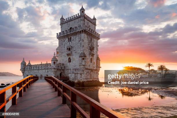 sunset, torre belem, lisbon, portugal - wahrzeichen stock-fotos und bilder
