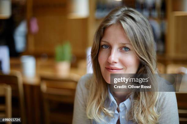 portrait of confident woman - blonde blue eyes stock-fotos und bilder