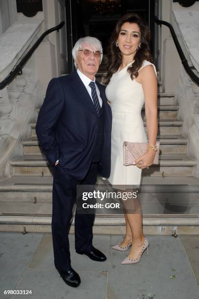 Bernie Ecclestone and Fabiana Flosi arriving at the Petra Stunt fundraiser at the Corinthia hotel on June 19, 2017 in London, England.