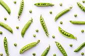 Peas pattern. Top view of fresh vegetable on a white background. Repetition concept