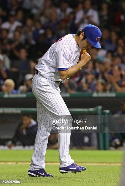 Koji Uehara of the Chicago Cubs celebrates after pitching a scoreless 8th inning against the San Diego Padres at Wrigley Field on June 19, 2017 in...