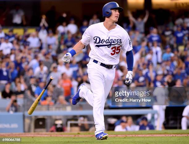 Cody Bellinger of the Los Angeles Dodgers reacts to his solo homerun, his second homerun of the game, to take a 7-0 lead over the New York Mets...