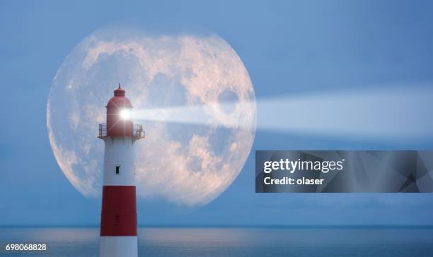 lighthouse and moon - beacon stock pictures, royalty-free photos & images