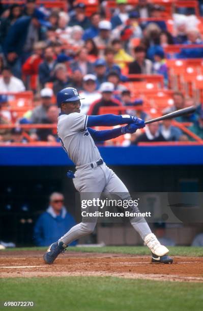 Eric Davis of the Los Angeles Dodgers swings at the pitch during an MLB game against the New York Mets on May 10, 1992 at Shea Stadium in Flushing,...