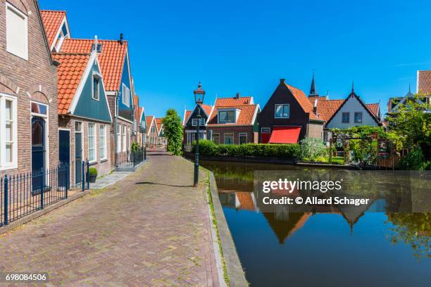 street and canal in volendam netherlands - volendam stock pictures, royalty-free photos & images