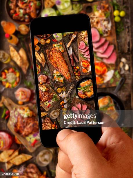 food selfie of bbq feast - hand chicken wing stock pictures, royalty-free photos & images