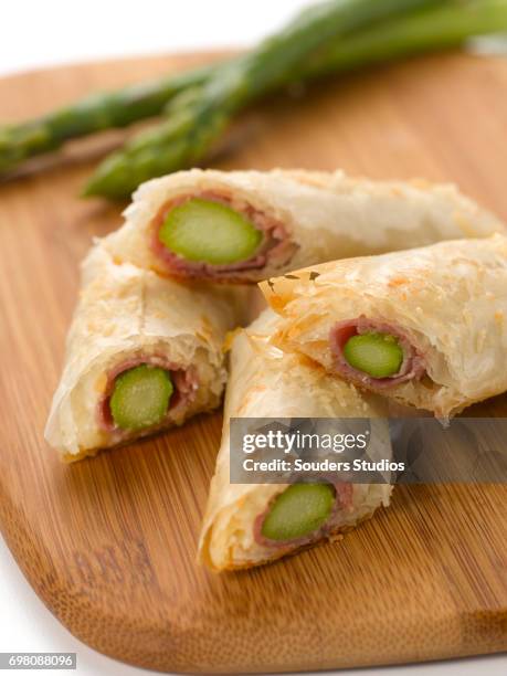asparagus proscuitto wraps - prosciutto wrapped stock pictures, royalty-free photos & images