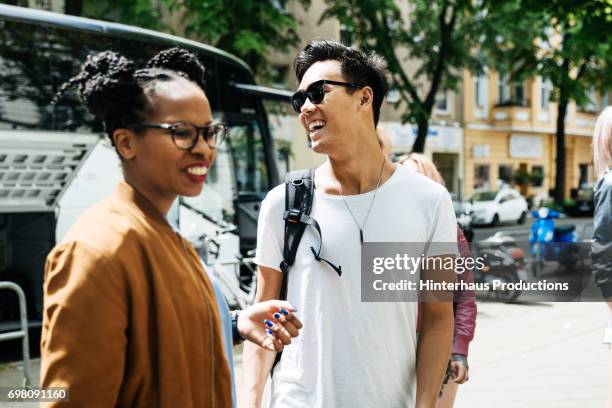 couple laughing together during bus journey rest stop - 2 men in car photos et images de collection