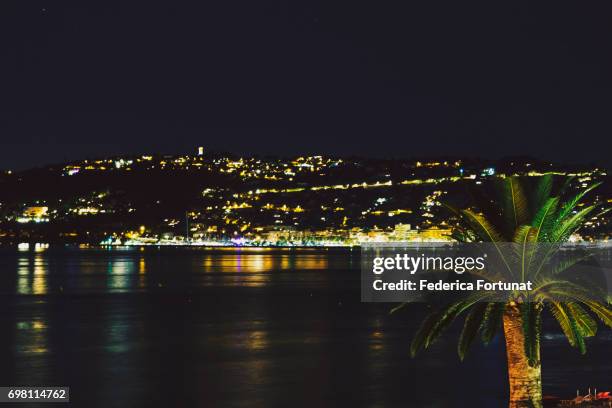 night view of the mediterranean sea and french riviera coastline - antibes stock pictures, royalty-free photos & images