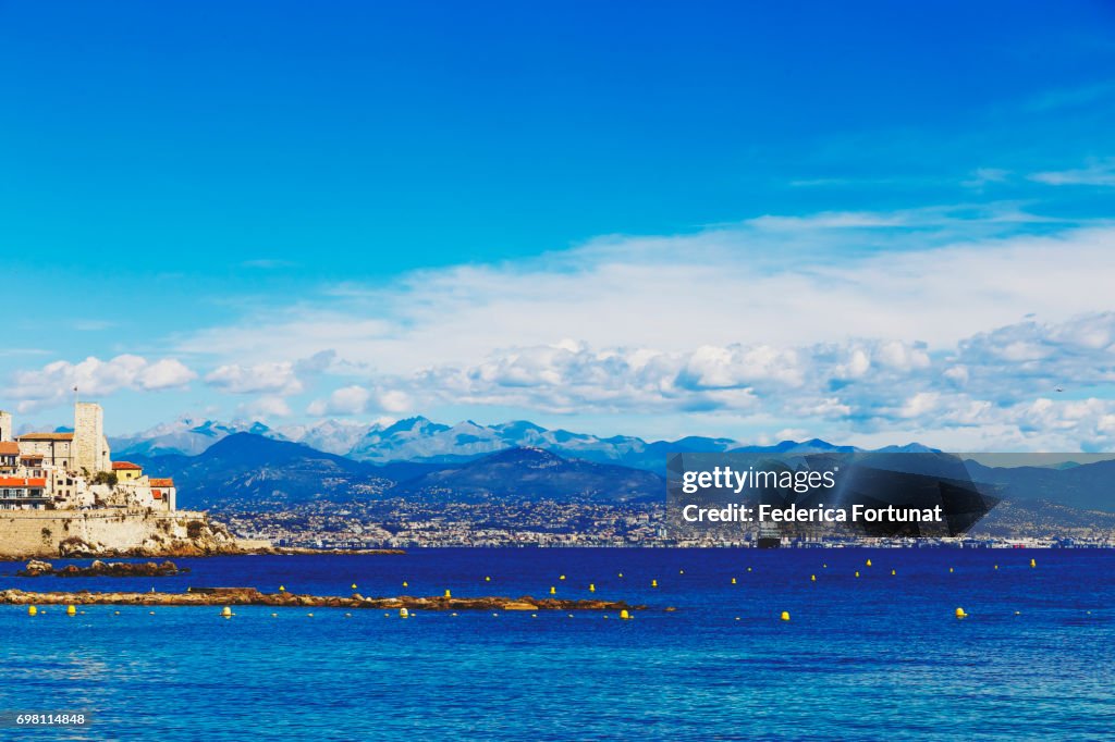 Blue Mediterranean landscape and Antibes Old Town and coastline