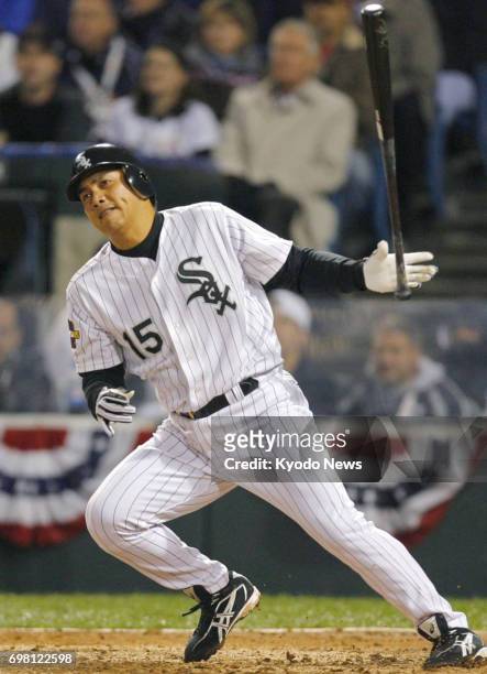 File photo taken in October 2005 shows Tadahito Iguchi hitting a single for the Chicago White Sox in Game 2 of the World Series against the Houston...