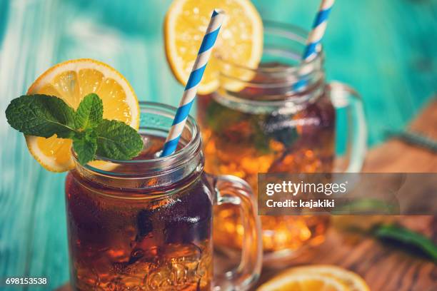 ice tea with lemon and mint in a jar - ice tea stock pictures, royalty-free photos & images